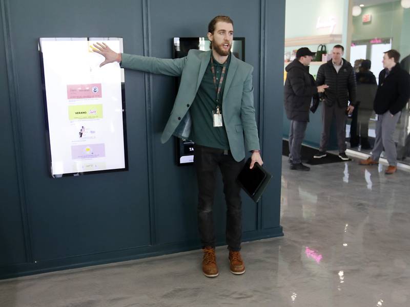 Zachary Edgerton, the general manager of the Ivy Hall Crystal Lake, gives a tour during an open house Thursday, Feb. 2, 2023, at the social equity-licensed marijuana dispensary that recently opened at 501 Pingree Road in Crystal Lake.