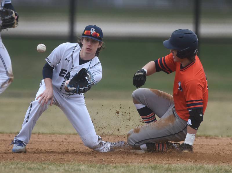 Naperville North's Tanner Malley, right, slides safely into second as Oswego East's Carter South waits for the ball during Wednesday's baseball game in Naperville.