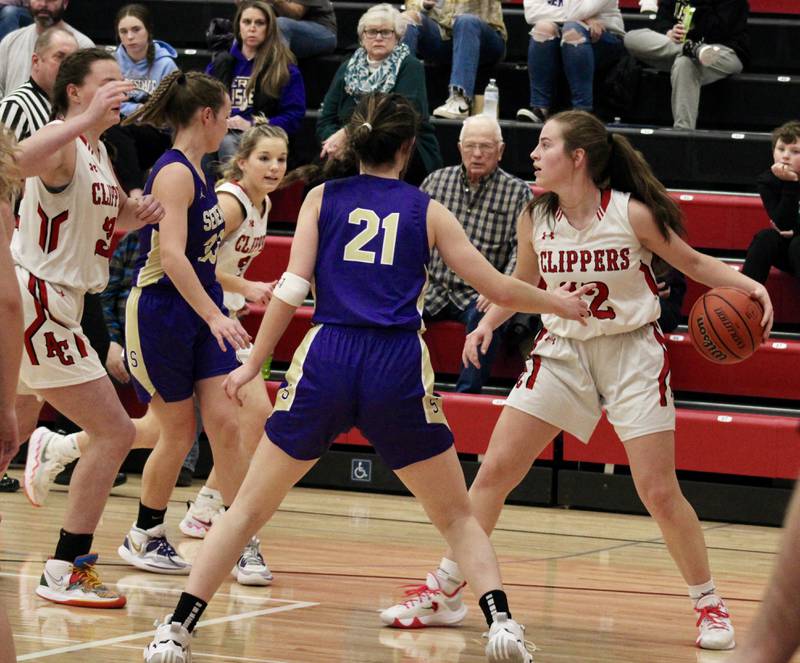 Amboy's Addison Pertell (12) dribbles into the corner against a collapsing Serena defense on Thursday during the Amboy Girls Holiday Basketball Tournament.