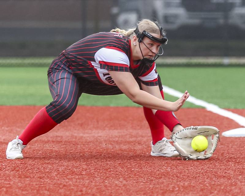 Yorkville's Callie Ferko (9) fields a shot to first during softball game between Joliet West at Yorkville on Wednesday, April 30, 2025 in Yorkville.