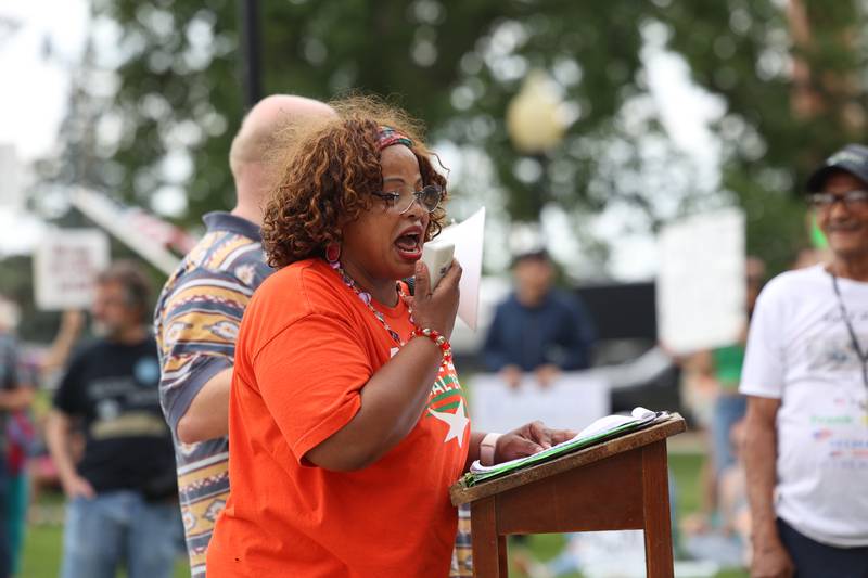Charlene Eads, an organizer with the Illinois Democratic Women of Kankakee County, speaks to the approximately 500 people gathered at the Kankakee County Courthouse for a ‘No Kings’ rally in Kankakee on Saturday, June 14, 2025, to protest actions by President Donald Trump.