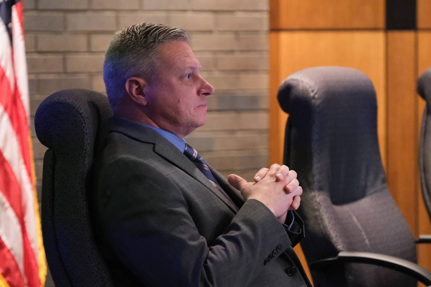 Joe Clement, Council at Large and former police officer, listens to a public speaker regarding the Police Department Citizen Advisory Board proposal at the Council Chambers in Joliet City Hall. Monday Nov. 8, 2021.