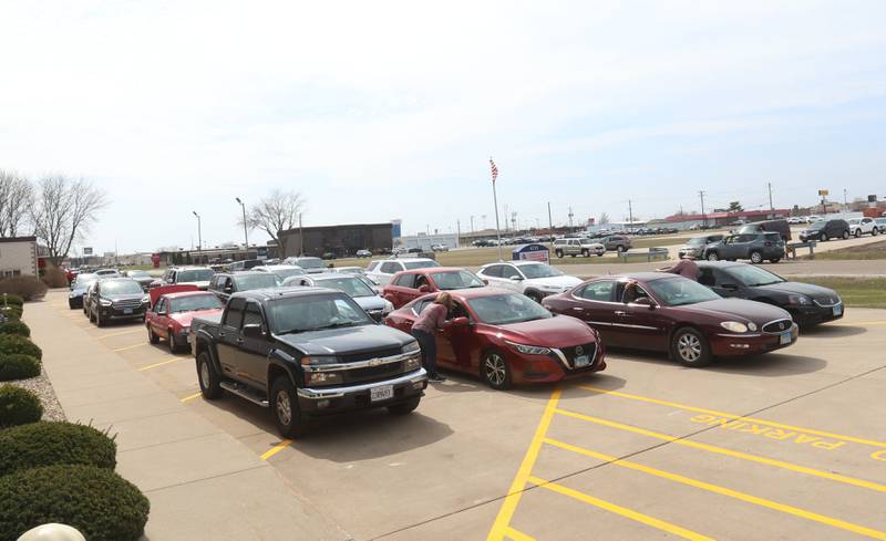 A long line of cars wait for their turn to load during the Easter distribution on Wednesday, March 25, 2026 at the Illinois Valley Food Pantry in Peru.