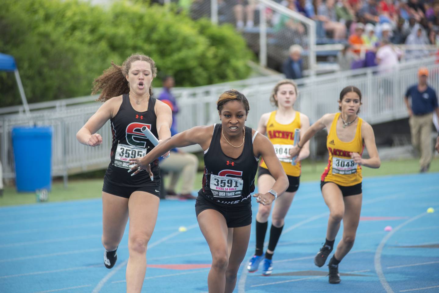 Plainfield East's D'aria Christian (right) Elissa Perkins competes in the 3A 4x2 finals during the IHSA girls state championships, Saturday, May 21, 2022 in Charleston.