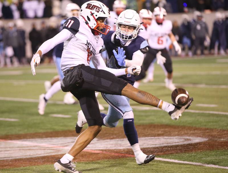 Mt. Zion's Brayden Trimbel gets the punt off as DePaul's Michael Casper tips it during the Class 4A State football championship on Friday, Nov. 29, 2024 at Hancock Stadium in Normal.