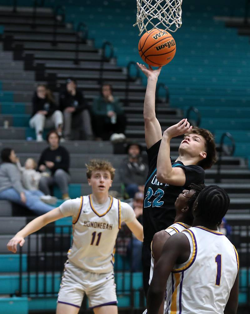 Woodstock North's Curtis Czeslawski drives to the basket against the Hononegah defense during the 2025 Hoops for Healing tournament basketball game on Wednesday, Nov. 26, 2025, at Woodstock North High School.