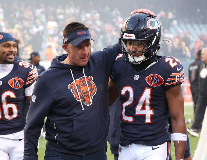 Chicago Bears defensive coordinator Dennis Allen and cornerback Nick McCloud celebrate Sunday, Nov. 23, 2025, after their 31-28 win over the Pittsburgh Steelers at Soldier Field in Chicago.