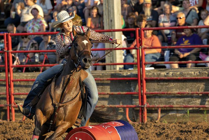 Sawyer Stockton competes in the barrel racing event Thursday, August 7, 2025, at Carroll County Fair’s T and A Bucking Bulls Rodeo.