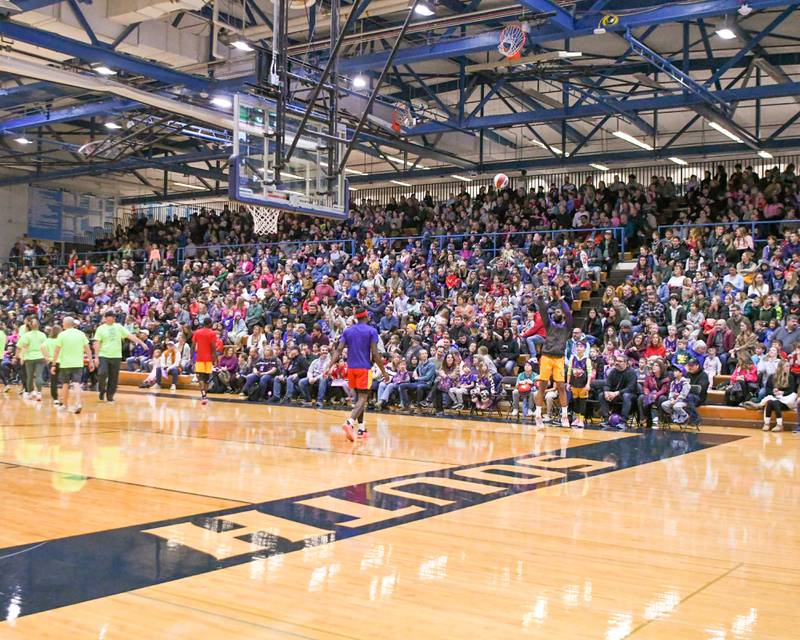 A sold-out gym watches the Harlem Wizards warm up before the game on Sunday Jan. 19, 2025, held at Downers Grove South High school.