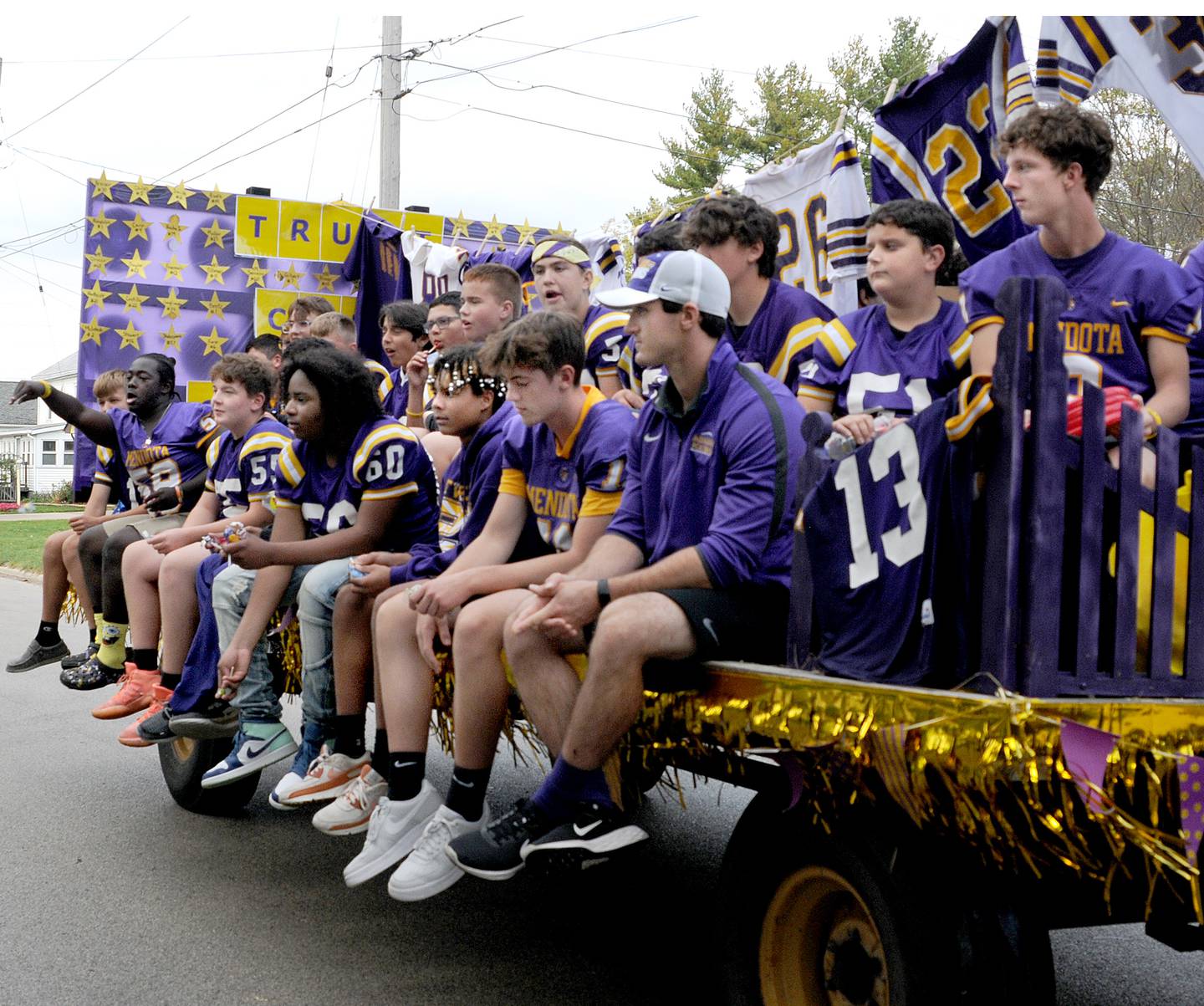 The Mendota High School football team rides Thursday, Oct. 6, 2022, on a float along the parade route on Wisconsin Street, Thursday, Oct, 6, 2022, during the school’s homecoming parade.