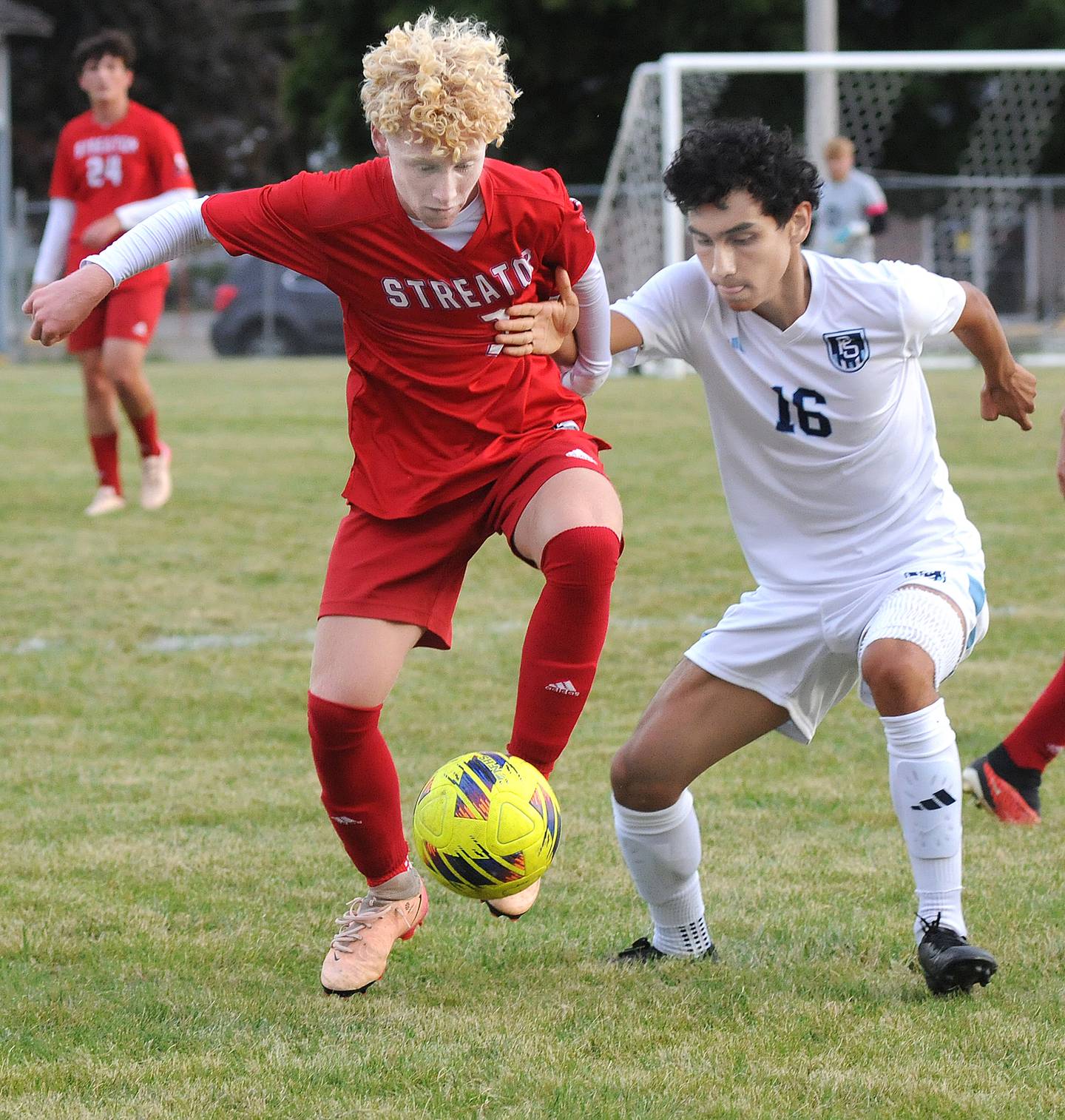 Streator’s Mason Decker and Plainfield South’s Angel Cepeda (16) work for control of the ball in the first half Tuesday, Sept. 9, 2025, at Streator.