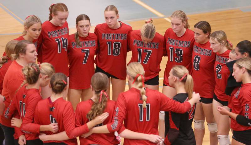 Members of the Erie-Prophetstown volleyball team gather during a timeout while playing Seneca in the Class 2A Sectional semifinal game on Tuesday, Nov. 5, 2024 at Bureau Valley High School.