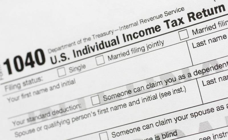 FILE - A portion of the 1040 U.S. Individual Income Tax Return form is shown July 24, 2018, in New York. (AP Photo/Mark Lennihan, File)