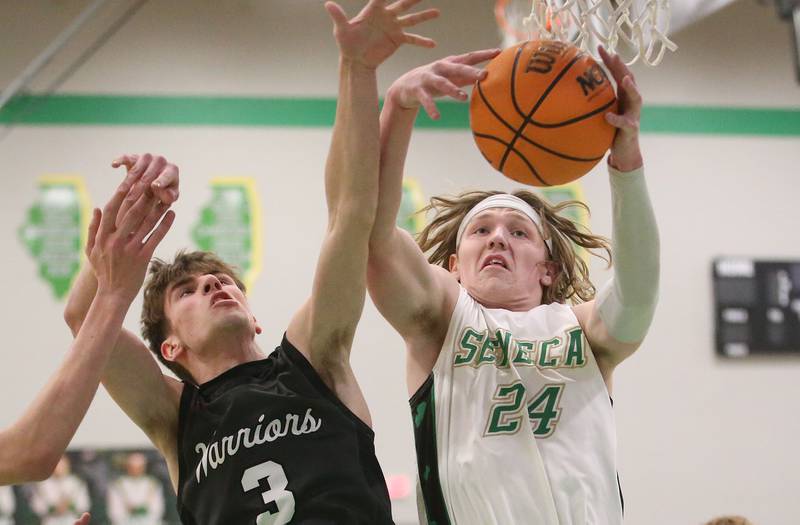 Seneca's Grant Siegel grabs a rebound over Woodland's Quentin Porter on Friday, Feb. 14, 2025 at Seneca High School.