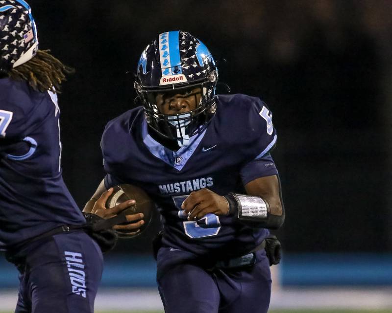 Downers Grove South's Kayden Smith (5) runs up the middle during Class 8A Playoff football game between Plainfield South at Downers Grove South on Friday, Nov 1, 2024  in Downers Grove.