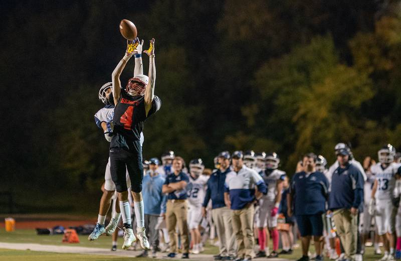 Nazareth Academy's James Penley (11) deflects a pass intended for Benet Academy's Pat Pitello (4) during a football game at Benedictine University in Lisle on Friday, Oct 21, 2022.