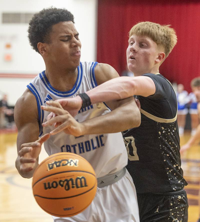 Newman’s Tyson Williams is fouled by Pecatonica’s Cooper Hamilton Tuesday, March 3, 2026, in the 1A sectional semifinal.