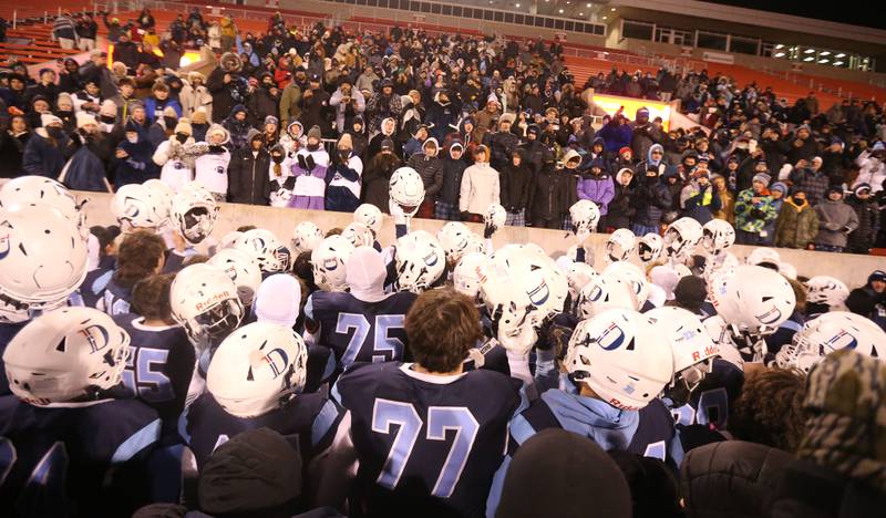 Members of the DePaul football team react with fans after winning the Class 4A State football championship on Friday, Nov. 29, 2024 at Hancock Stadium in Normal.