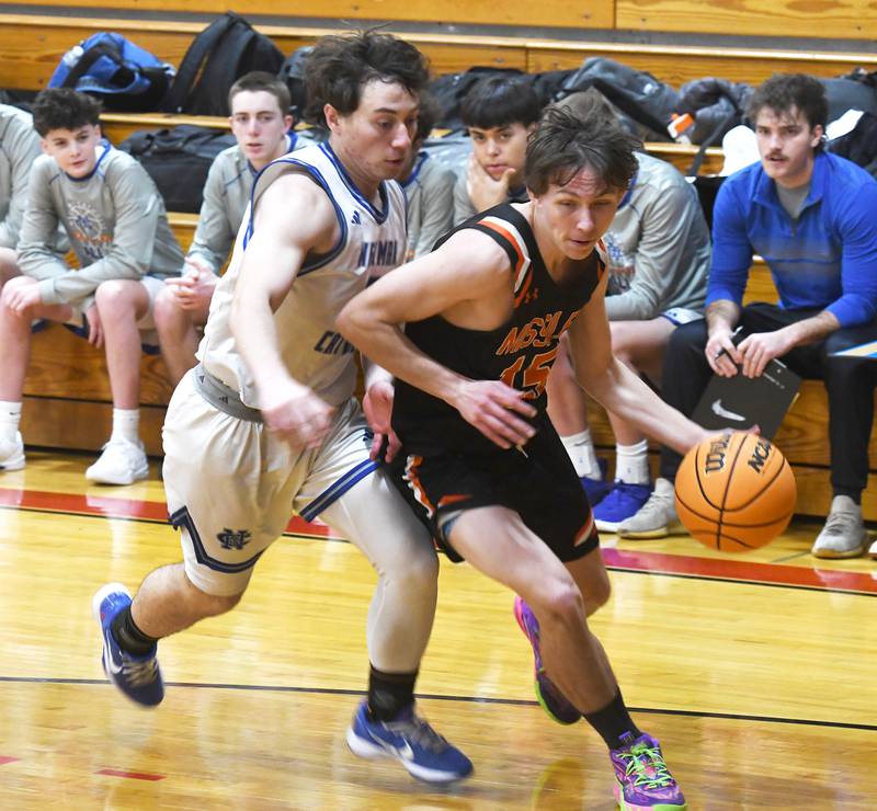 Milledgeville's Rayden Ehredt (15) drives to the basket as Newman's Garret Matznick (3) defends during Saturday, Dec. 13, 2025 action at the 64th Annual Forreston Holiday Basketball Tournament at Forreston High School.
