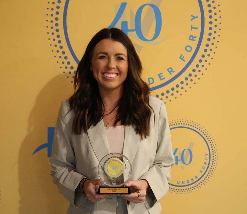 Allison Warren poses for a photo with her award during the 40 Under Forty awards banquet on Thursday, March 21, 2024 at Westclox in Peru.