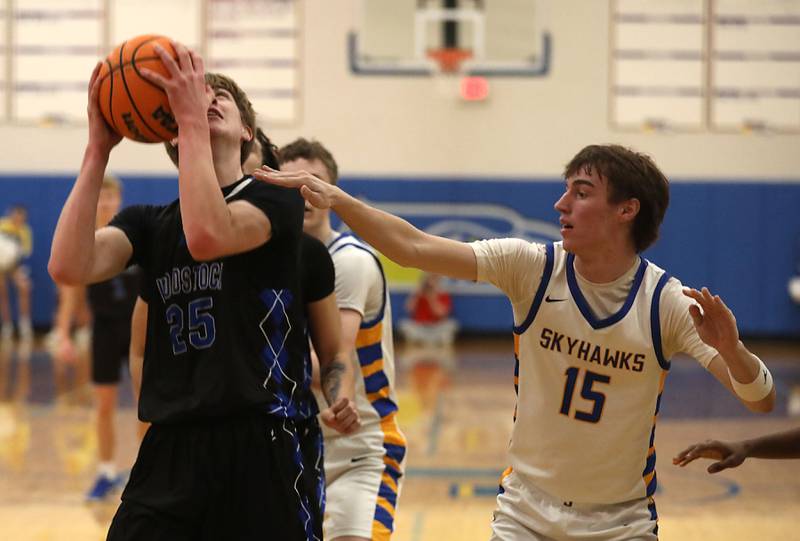 Woodstock's Liam Laidig tries to get a shot off as he is guarded by Johnsburg's Ashton Stern during a Kishwaukee River Conference boys basketball game on Friday, February. 13, 2026, at Johnsburg High School.