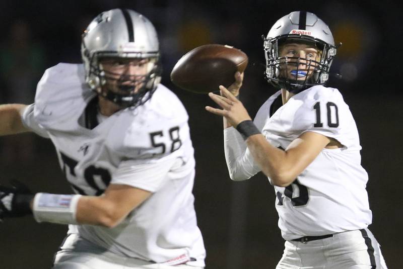 Kaneland's Troyer Carlson looks for a receiver during their game Friday, Sep. 10, 2021 at Sycamore High School.