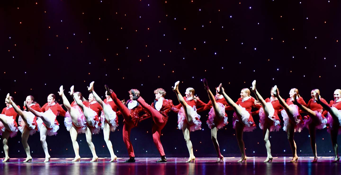 Dancers practice their kicks during rehearsals for this year's On Broadway Dancers Christmas show.