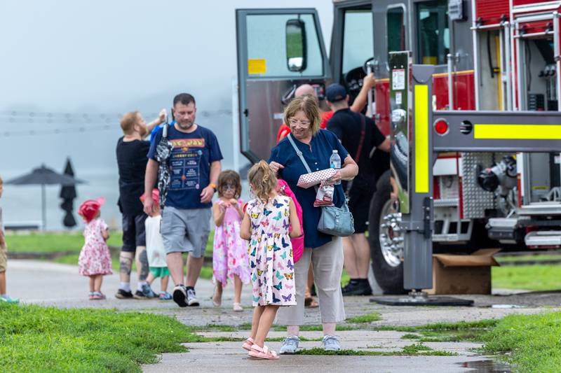 Summer Graham and grandmother Carol Wilcox attend the Touch a Truck event on Sunday, July 27, 2025, at Riverfront Park in Ottawa.