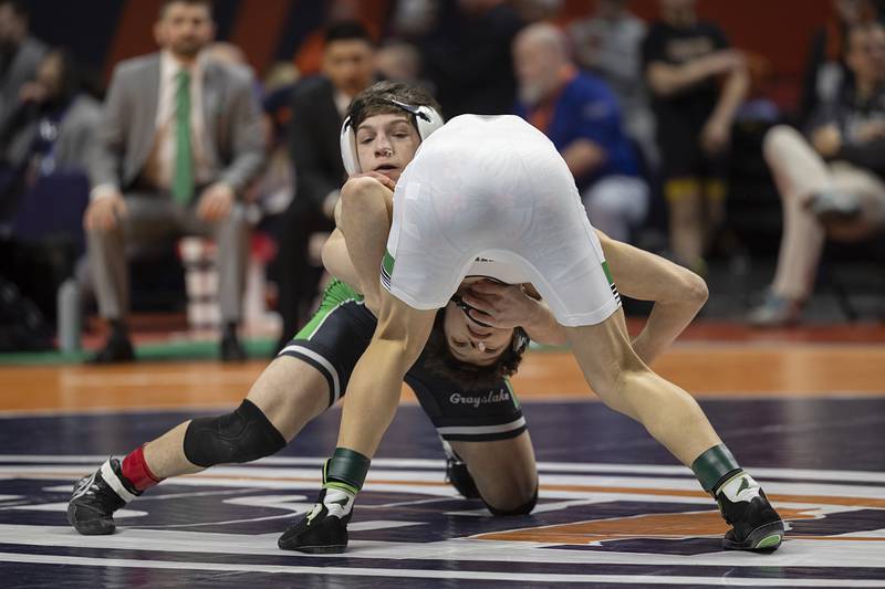 Grayslake Central’s Vince DeMarco (top) competes against Christian Corcoran of Providence Catholic in the 2A 113 pound class Saturday, Feb. 21, 2026, at the IHSA wrestling finals in Champaign.
