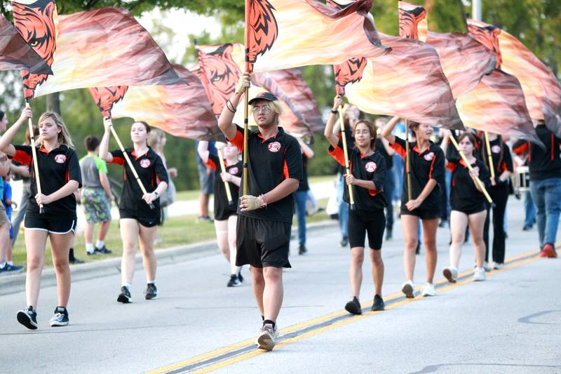 The Wheaton Warrenville South color guard march in the school’s annual homecoming parade on Wednesday, Sept. 11, 2024 on Weisbrook Road in Wheaton.