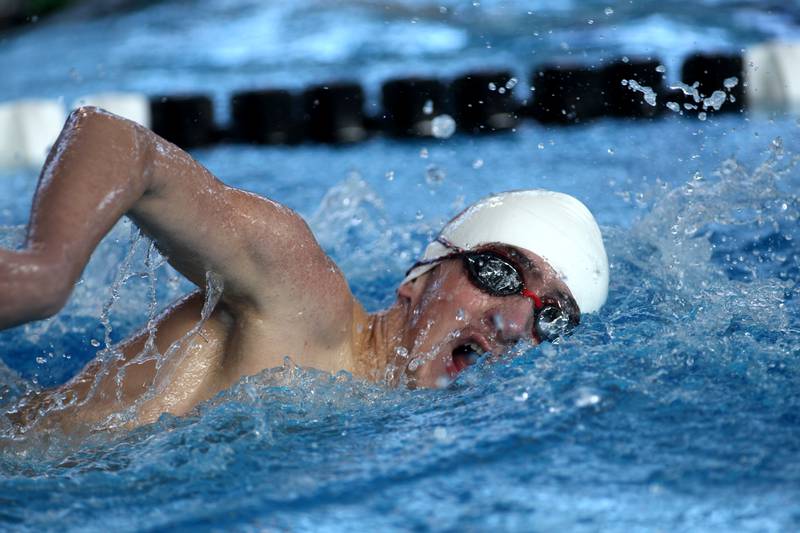 St. Charles East’s Leo Czerwinski competes in the athletes with disabilities heat of the 200-yard freestyle during the IHSA Boys Swimming and Diving Championships at FMC Natatorium in Westmont on Saturday, Feb. 26. 2022.