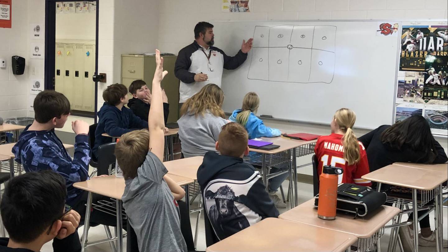 Dusty Behringer teaching his sixth grade social studies class Monday March 20, 2023 at Sandwich Middle School.