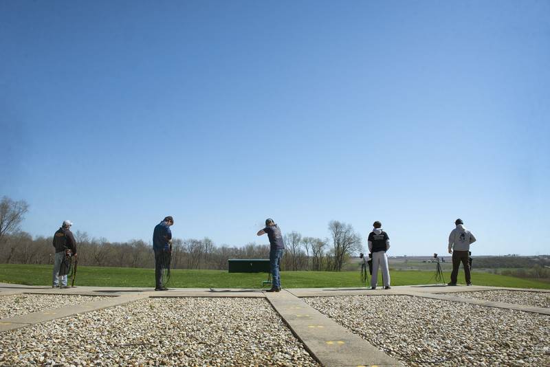 Shooters line up at one of five shooting stations at the trap field. After five shots, competitors move one station to the left.