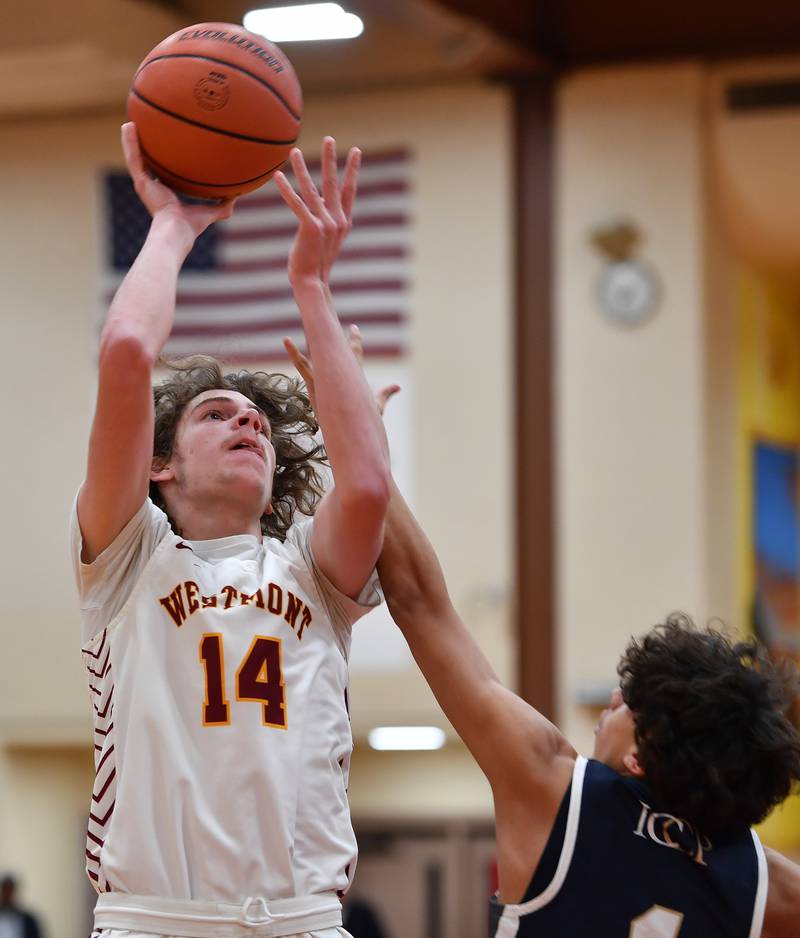 Westmont's Billy McGhie (14) shoots for two points during a game against IC Catholic Prep on Jan. 5, 2024 at Westmont High School in Westmont.