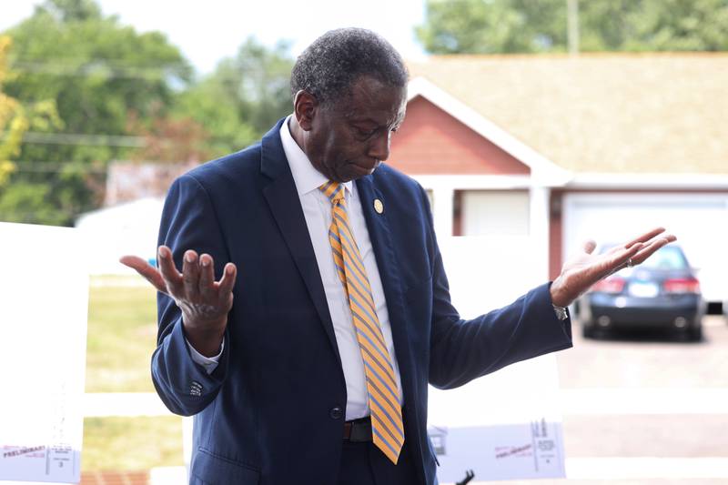 Theodis Pace gestures as the crowd applauds after he was honored with a street dedication during the West Harbor Residences ribbon cutting and street dedication ceremony on Wednesday, July 23, 2025. West Pace Boulevard was named in honor of Pace, a longtime Kankakee resident and community advocate.