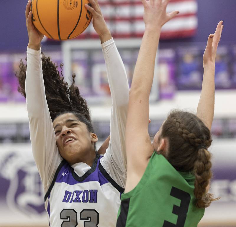 Dixon's Ahmyrie McGowan pulls down a rebound against Rock Falls’ Ashley Rodriguez Friday, Jan. 31, 2025, at Dixon High School.