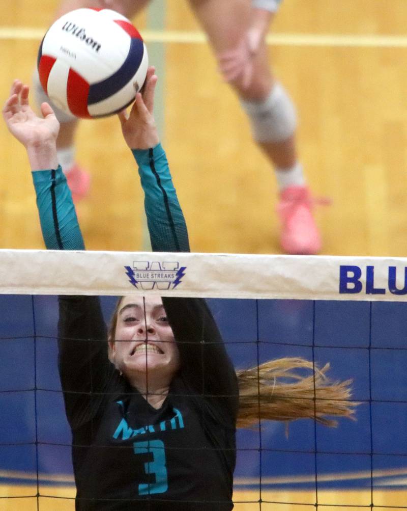 Woodstock North’s Adelyn Crabill blocks against Crystal Lake Central in IHSA girls volleyball Class 3A Regional action at Woodstock High School in Woodstock on Thursday, October 30, 2025.