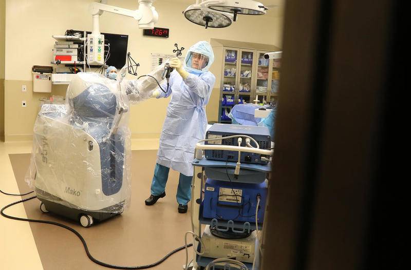 Northwestern Medicine's Dr. John Daniels prepares Jan. 15 to perform a partial knee replacement surgery using a Mako robotic-arm by Stryker at Northwestern Medicine Huntley Campus in Huntley.