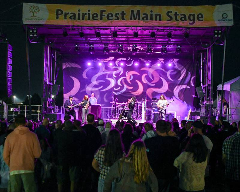 The Prince Experience a Prince Tribute band preforms during PrairieFest on Thursday June 12, 2025, held at PrairieFest Park in Oswego.