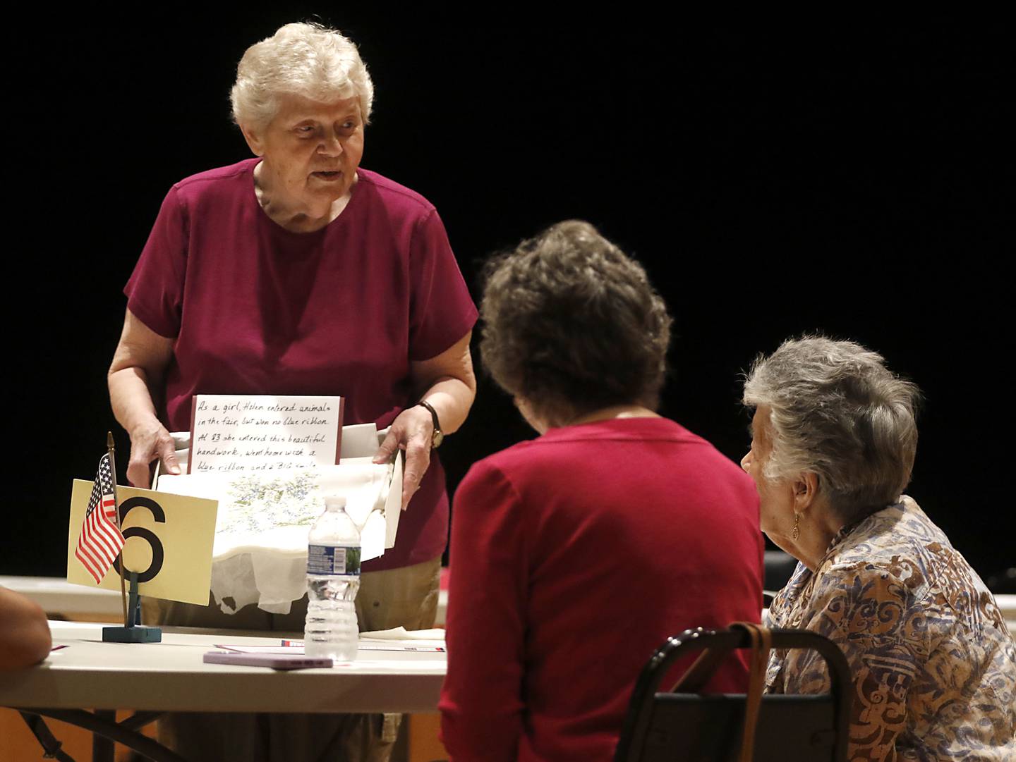 Judy Porter talks to seniors in Huntley Thursday, June 27, 2024, about entering some of dozens of contests available, from baking to sewing to antiques.