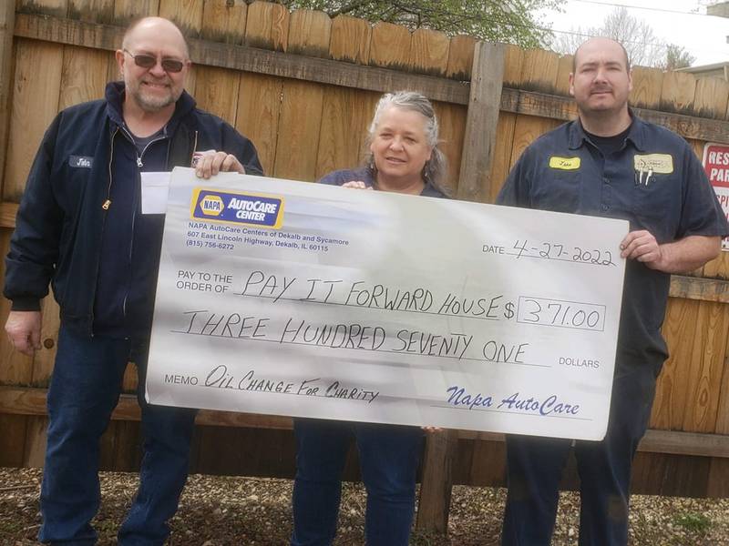 NAPA AutoCare Centers of DeKalb County check donation of $371. Pictured (from left to right): John Volkert of Barb City Automotive, Representative from the Pay it Forward House, and Jake Schneider of Archer Alignment.