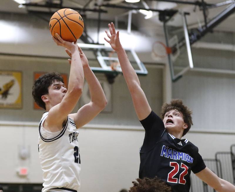 Cary-Grove's Brady Elbert shoots the ball over Marmion's Colin McEniry  during an IHSA Class 3A Crystal Lake South Regional boys basketball semifinal game on Wednesday, February, 25, 2026, at Crystal Lake South High School.