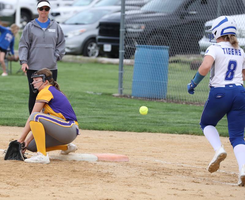 The throw gets past Mendota first baseman Kirby Bond as Princeton's Samatha Woolley runs safely to first base.