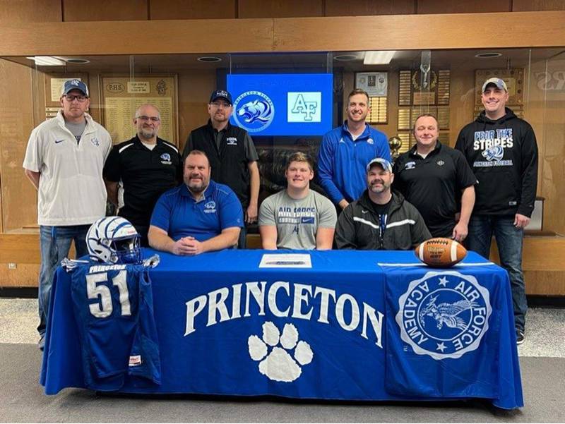 Princeton senior Bennett Williams (front center) was joined by his coaches at PHS for his signing day with the Air Force Academy on Friday, including (front row, from left) Dan Foes and Ryan Pearson; and (back row), RK Lunn, Curtis Odell, Brandon Crawford, Patrick Smith, Steve Amy and Nick Lower.