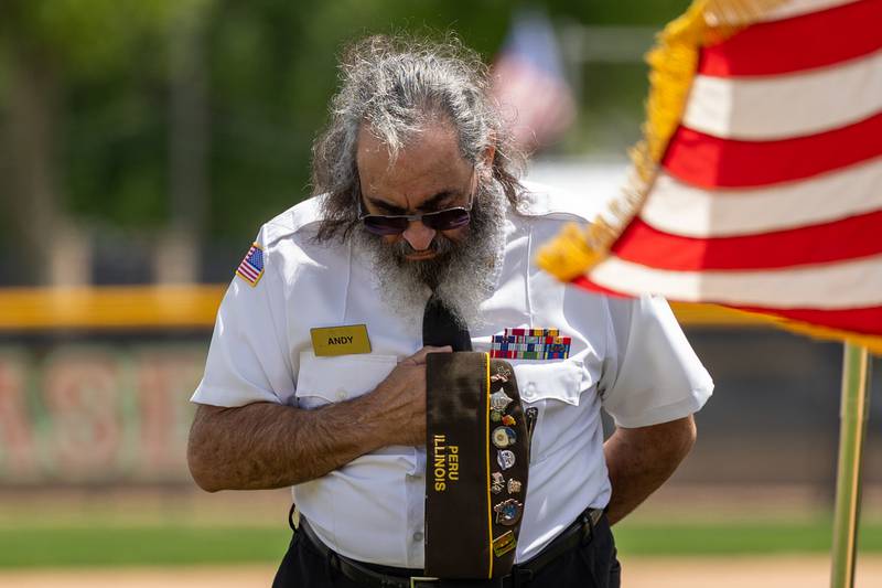 Andy Ruggerio of the Peru Honor Guard bows during prayer on Monday, May 26, 2025 at Washington Park in Peru.