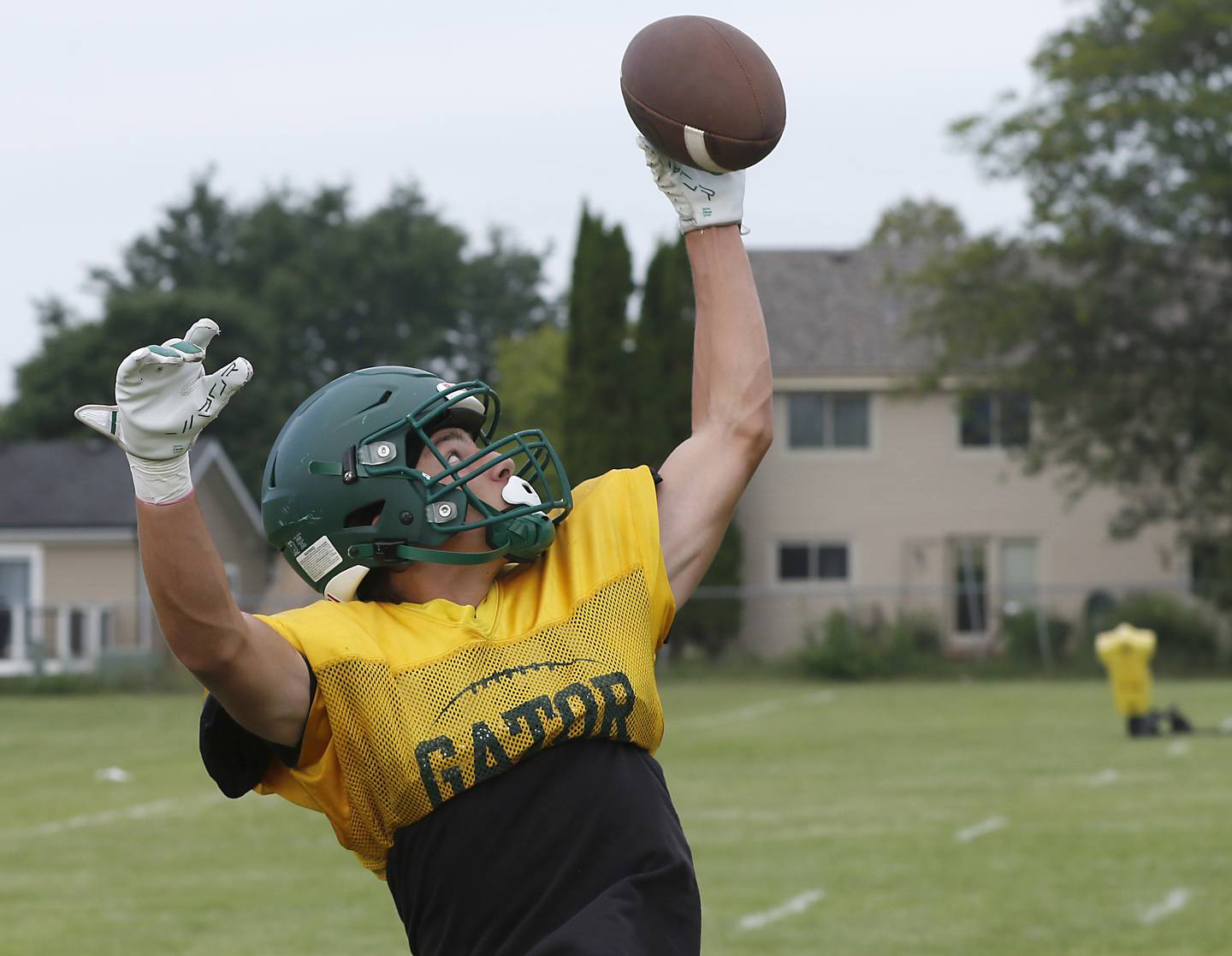 Crystal Lake South’s Eddie Phillips catches a pass during football practice on Wednesday, July 23, 2025, at Crystal Lake South High School.