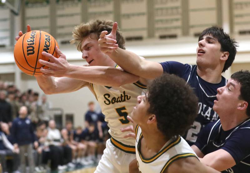Crystal Lake South's Carson Trivellini battles with Cary-Grove's AJ Berndt for a rebound during a Fox Valley Conference boys basketball game on Friday, Jan. 23, 2026, at Crystal Lake South High School.