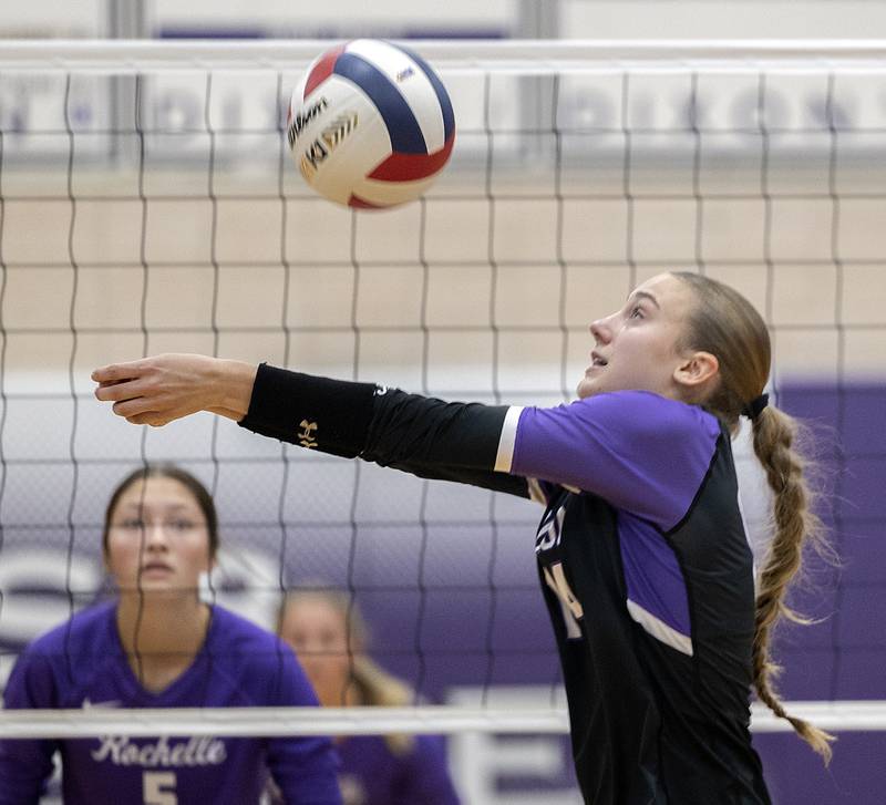 Dixon’s Leah Carlson makes a pass against Rochelle Monday, Oct. 28, 2024, during regional play in Dixon.