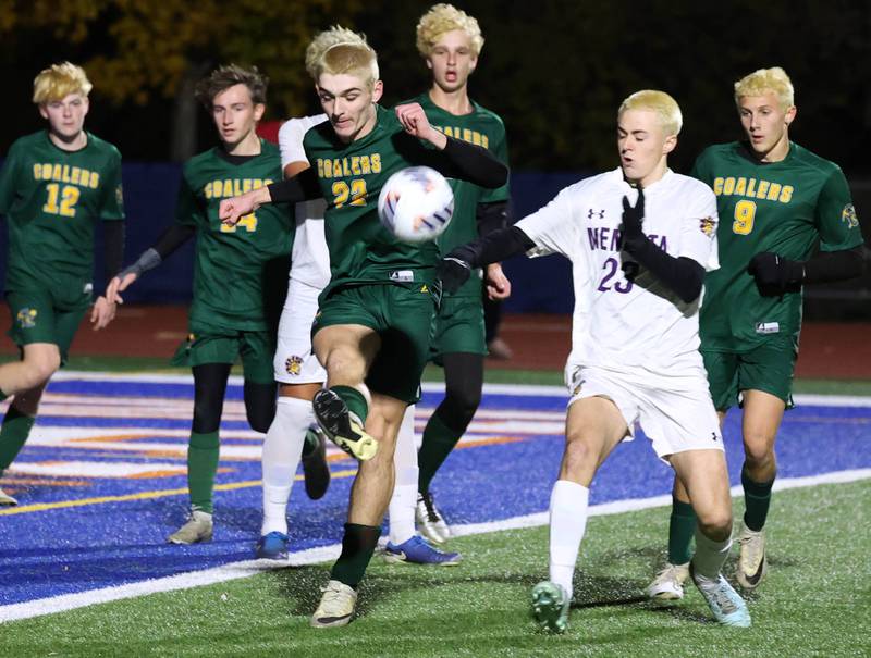 Coal City's Parker Jacovec kicks the ball away from Mendota's Alex Beetz Thursday, Nov. 6, 2025, during their Class 1A state semifinal game at Hoffman Estates High School.
