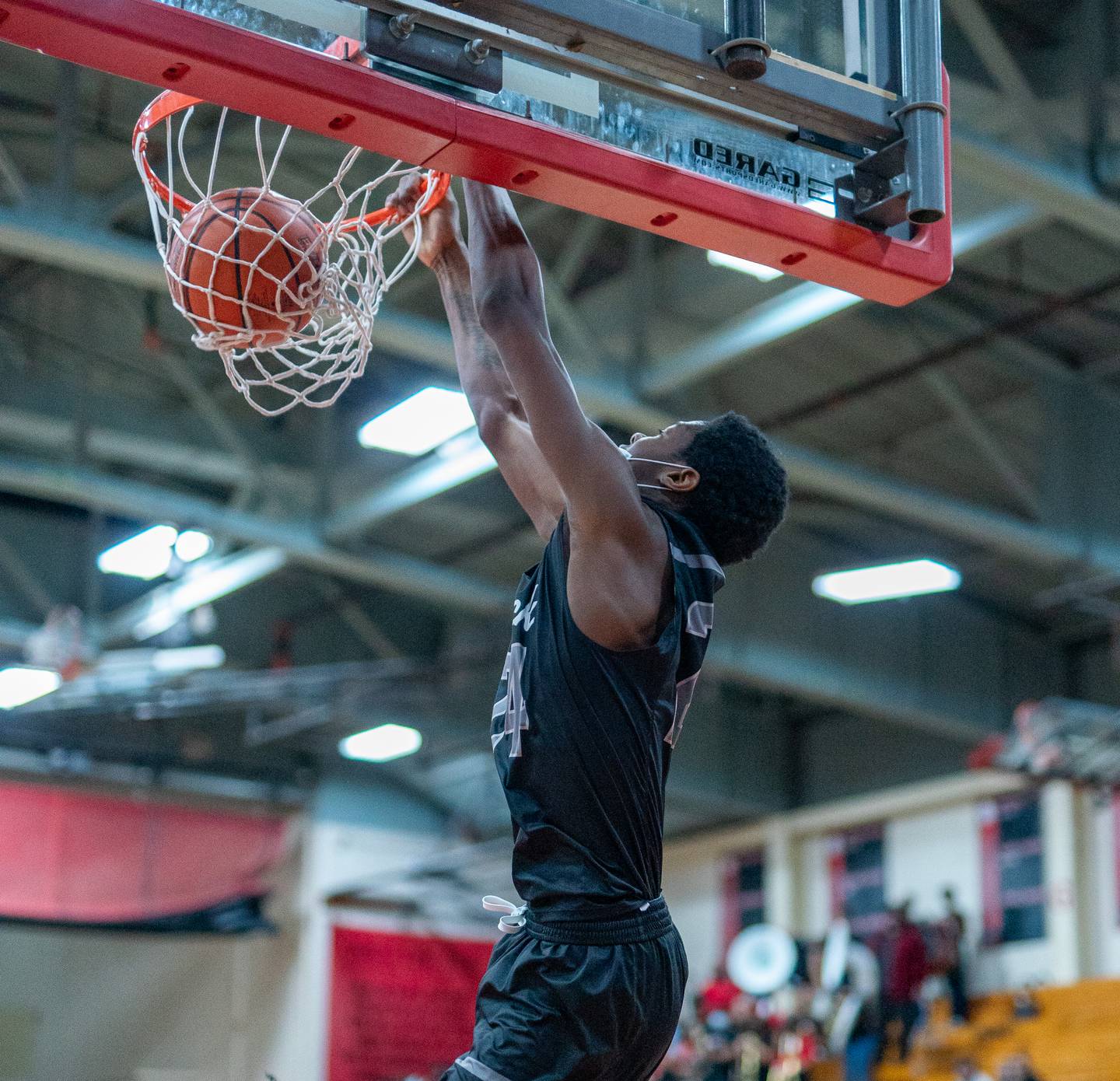 Oswego East's Mekhi Lowery (24) dunks the ball against East Aurora during the 11th Annual Kivisto Hoopfest at East Aurora on Saturday, Feb 5, 2022.